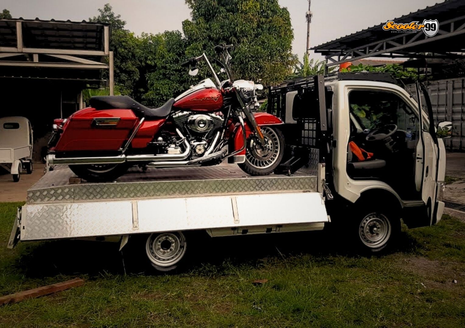 Towing truck in action, securing a vehicle on the roadside